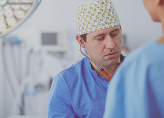 Man surgeon at work in operating room