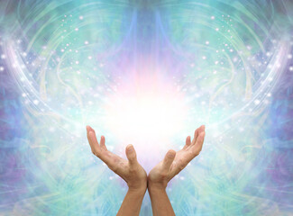 Connecting to High Resonance Healing Energy - female cupped hands reaching up into a beautiful...