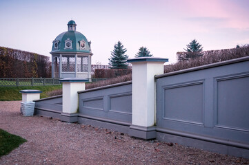 Gazebo in the autumn park at sunset. Latvia.
