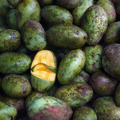 Close-up of heap of green fresh mango in Sri Lankan shop