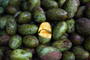 Close-up of heap of green fresh mango in Sri Lankan shop