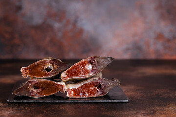 Sun dried salty fish with delicious caviar. Studio photo.