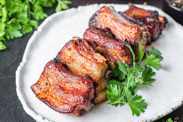 meat ribs piece grilled BBQ spice sauce second course snack ready to eat on the table meal top view copy space for text food background rustic