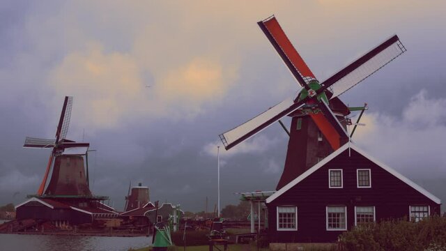 Traditional historic Dutch windmills in Zaanse Schans North Holland Nederland - sustainable clean energy tourist attraction