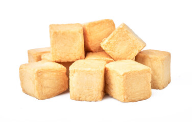 close-up of a pile of diced fish tofu isolated white background with clipping path