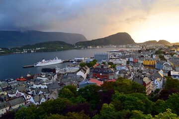 Evening view of Alesund skyline cityscape. Stunning picturesque sky at sunset. Famous norwegian landmark and popular destination. View from Aksla mountain, Norway