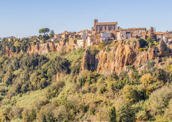 Fototapeta na wymiar Castel Sant'Elia - located on a scary cliff and famous for its wonderful basilica, Castel Sant'Elia is among the most notable villages in central Italy. Here a glimpse of the houses over the cliff