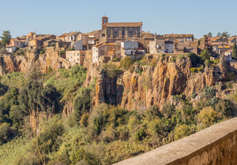 Fototapeta na wymiar Castel Sant'Elia - located on a scary cliff and famous for its wonderful basilica, Castel Sant'Elia is among the most notable villages in central Italy. Here a glimpse of the houses over the cliff