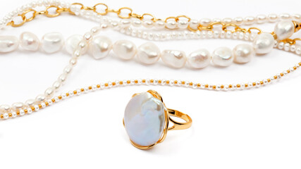 Luxury elegant baroque pearl ring and necklaces on white background