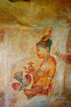 Sigiriya maiden with fruits: one of the 5th century frescoes at the ancient rock fortress of Sigiriya, a UNESCO World Heritage Site in Sri Lanka