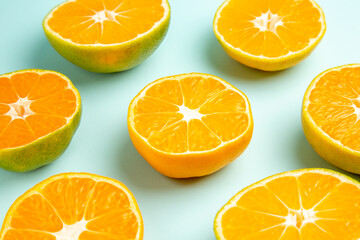 front view fresh tangerine slices on light-blue background photo fruit color juice citrus orange