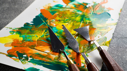 Set of oil color knifes. Painting spatulas. Palette knife and oil paints, closeup. Artistic tools concept