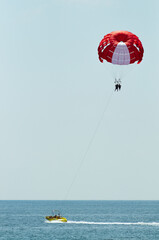 Couple flying on a paraglider 