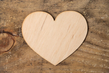 Obraz premium Wooden heart on wooden background