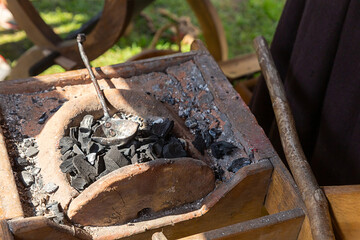 forge full of coal for smelting and forging metal, a traditional art for the manufacture of weapons