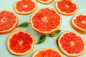 front view tasty fresh grapefruits lined on light-blue background health fruit diet fresh juice color