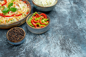 front view tasty vegetable salad with cabbage and bell-peppers on light-grey background health lunch diet color photo