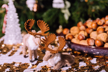 Christmas decoration with reindeer figures on table