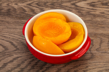 Marinated peaches fruit in the bowl