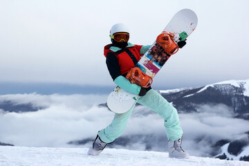 snowboarder girl in the Austrian mountains. winter time. The winter vacation. fun winter holidays in the mountains