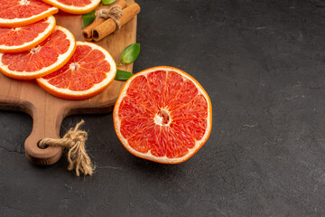 front view fresh grapefruit slices on dark background diet fresh color fruit healthy life