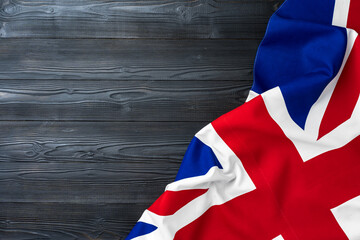 Fototapeta premium Flag of United Kingdom on wooden background