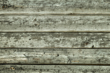 gray wooden horizontal boards old and weathered wall base