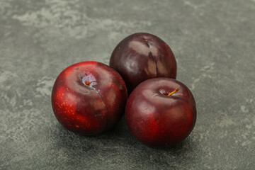 Ripe sweet plum fruit heap