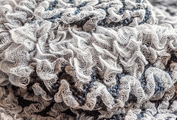 abstract background of grey voluminous mesh fabric