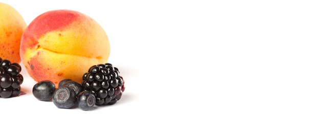 Ripe blueberry apricot and blackberry on white background. copy space