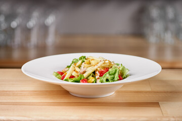 Veal medallion salad with apple, grapefruit. Delicious and healthy food concept on wooden background.