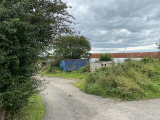 Discarded shipping containers, and old outbuildings on, Healey Croft Lane, East Ardsley, Wakefield, UK