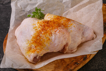 Raw chicken thigh with spices