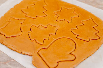 Gingerbread. The process of making homemade Christmas gingerbread. The woman bakes and decorates Christmas gingerbread.