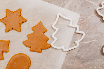 Gingerbread. The process of making homemade Christmas gingerbread. The woman bakes and decorates Christmas gingerbread.