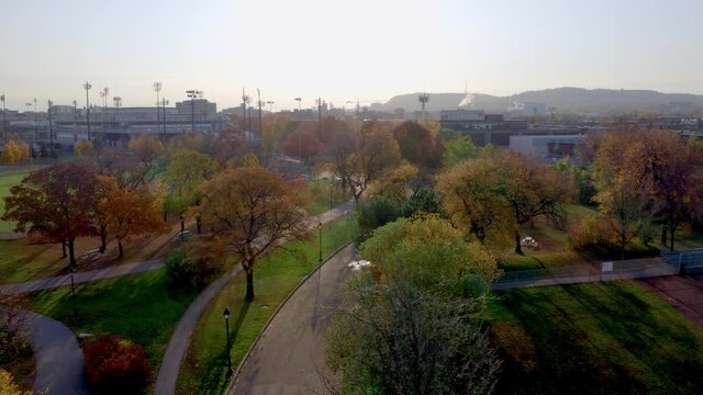 Aerial shot over a public parc in Montreal on a colourful autumn morning