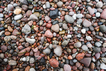 Texture of stones on the beach on the coast of the Baltic Sea.