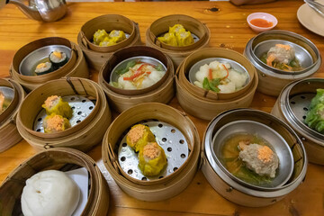 close up of variety dim sum in bamboo basket