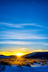 Fototapeta na wymiar Sunrise, Sunset over Horizon, Snow, mountains 