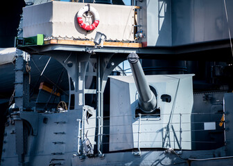 Cannon on the battle cruiser "Aurora" built in the 19th century on the Neva river in St. Petersburg. The inscription on the lifebuoys: "Aurora"
