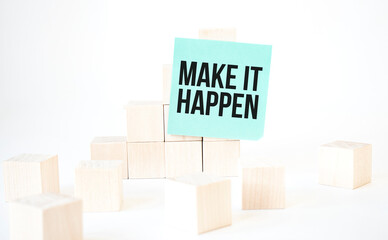 Text Make it happen writing in green card cube ladder. White background. Business concept