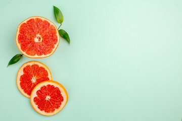 top view tasty grapefruits sliced juicy fruits on light-blue background healthy life juice fresh color diet free space