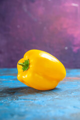 front view yellow bell-pepper on blue-pink background color food salad vegetable