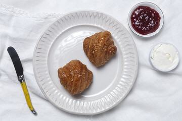 French Homemade fresh croissants with jam and butter