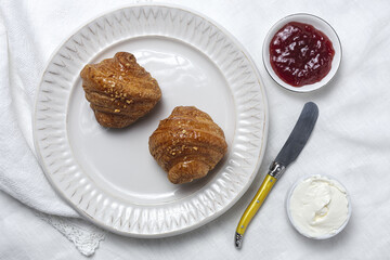French Homemade fresh croissants with jam and butter