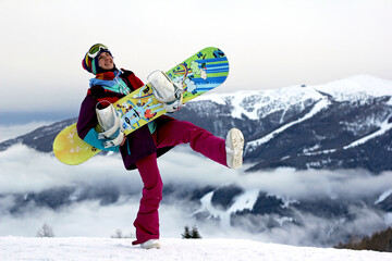 snowboarder happy girl in the Austrian mountains. winter time. The winter vacation. Holiday