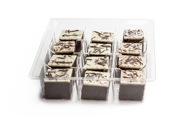 Chocolate brownie bites with sparklng chocolate topping isolated on white