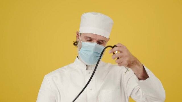 doctor in mask mandoctor corona quarantine xray x-ray virus yellow background medicine old doctor doctor corona quarantine xray x-ray virus yellow background medicine old doctor chef cook restaurant