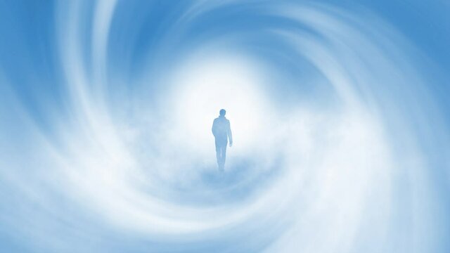 Walking in to the bright future. Back view of a man walks through abstract blue white foggy swirl tunnel. 