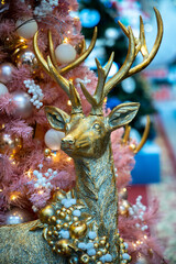 Golden deer at the Christmas tree